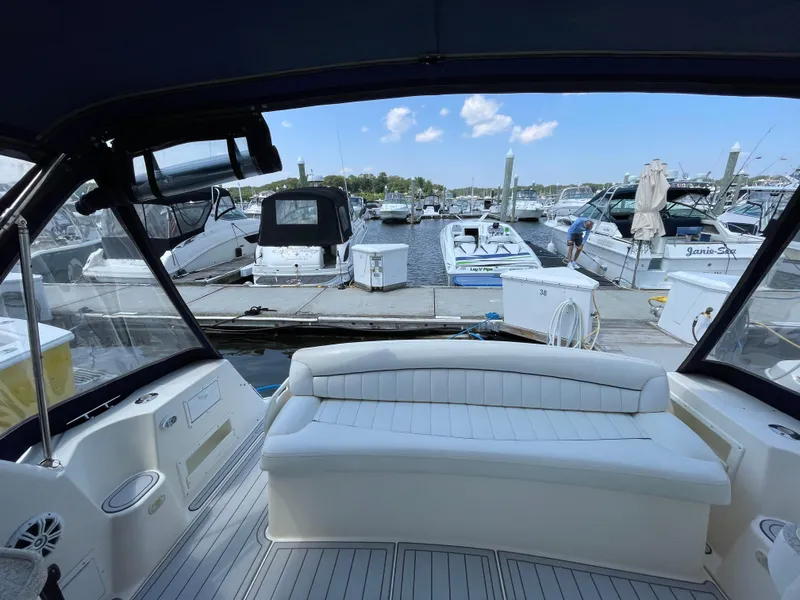Slide: The Image of Interior view of a 2000 Rinker Fiesta Vee 342 boat docked at a marina. - 5