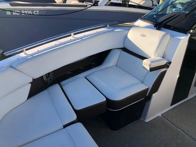 Slide: The Image of 2017 Regal 2800 boat interior with white cushioned seating. - 13