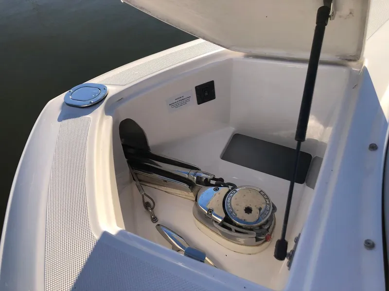 Slide: The Image of 2017 Regal 2800 boat anchor compartment with winch system. - 14