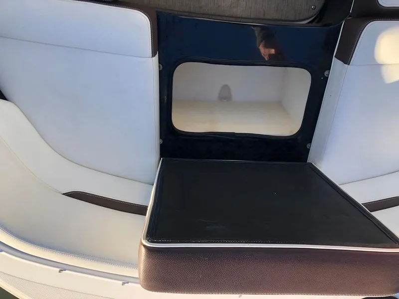 Slide: The Image of Regal 2800 boat interior seating, 2017 model, featuring white and black upholstery. - 17