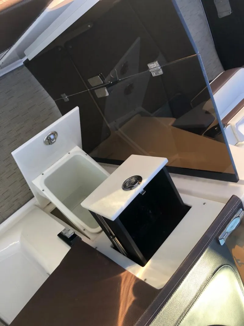 Slide: The Image of 2017 Regal 2800 boat interior with sleek black and white design elements. - 18