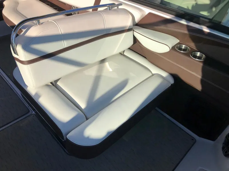 Slide: The Image of 2017 Regal 2800 boat interior with white and brown seating. - 25