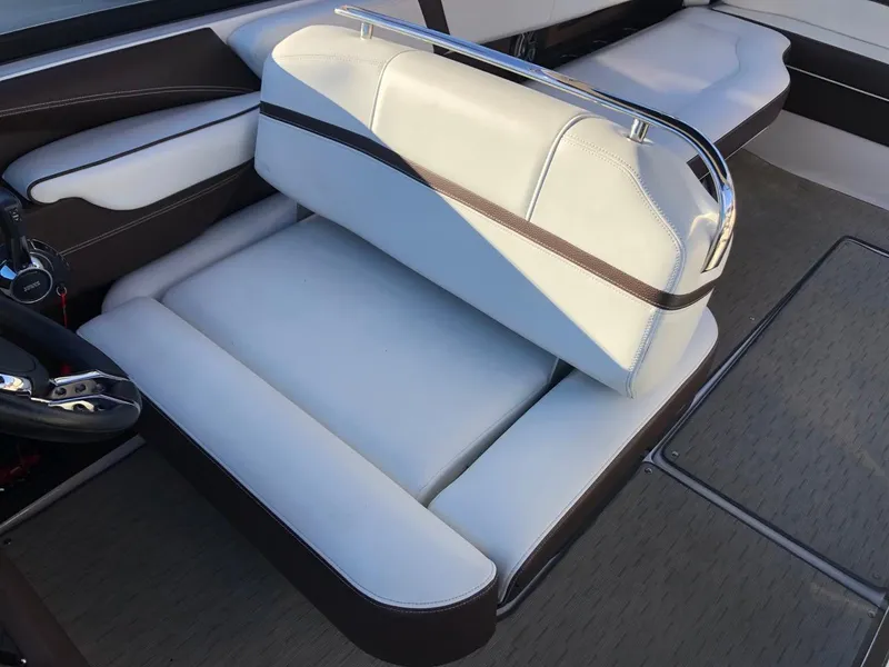Slide: The Image of 2017 Regal 2800 boat interior with white and brown seating. - 26