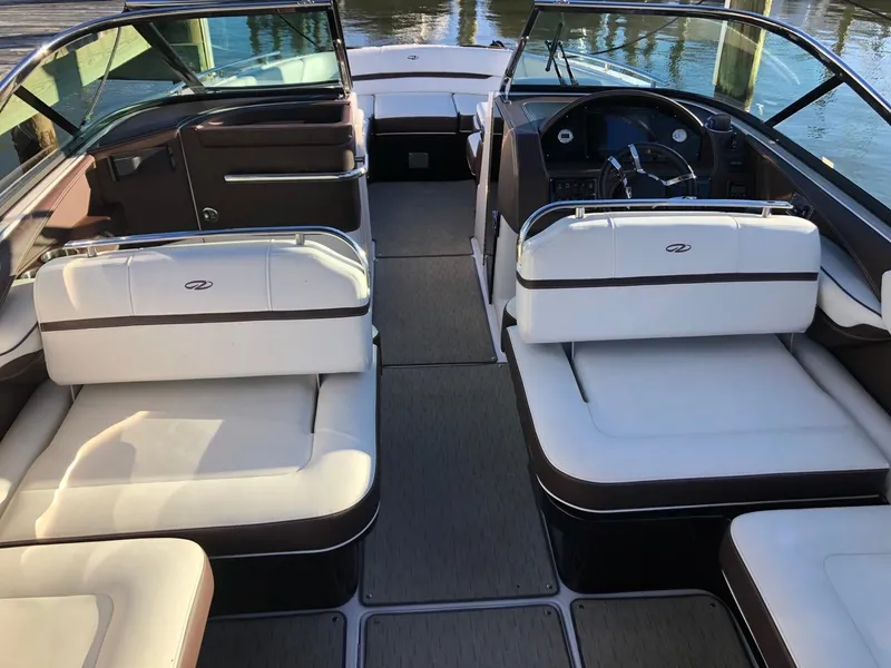 Slide: The Image of 2017 Regal 2800 boat interior with white seating and sleek dashboard design. - 27