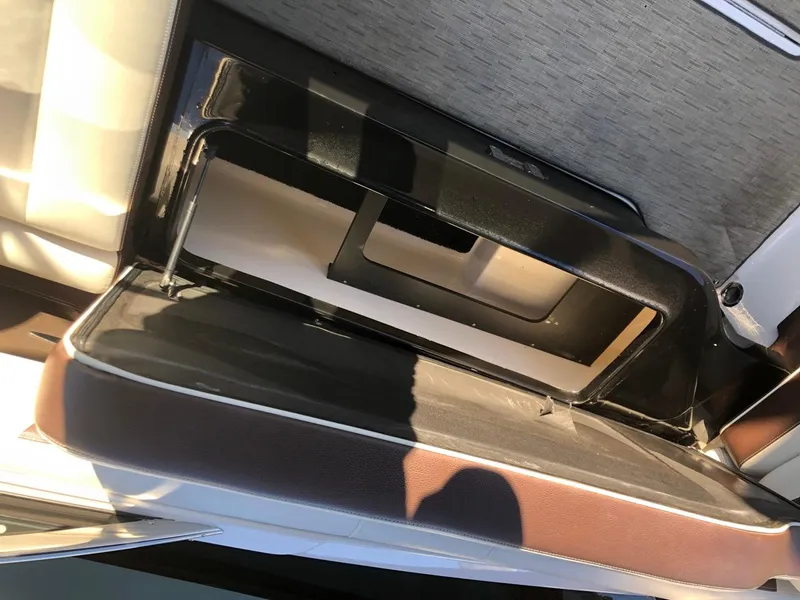 Slide: The Image of Open storage compartment in 2017 Regal 2800 boat interior. - 28