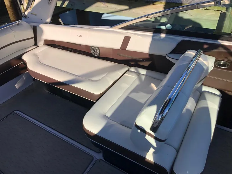 Slide: The Image of 2017 Regal 2800 boat interior with white and brown seating. - 29