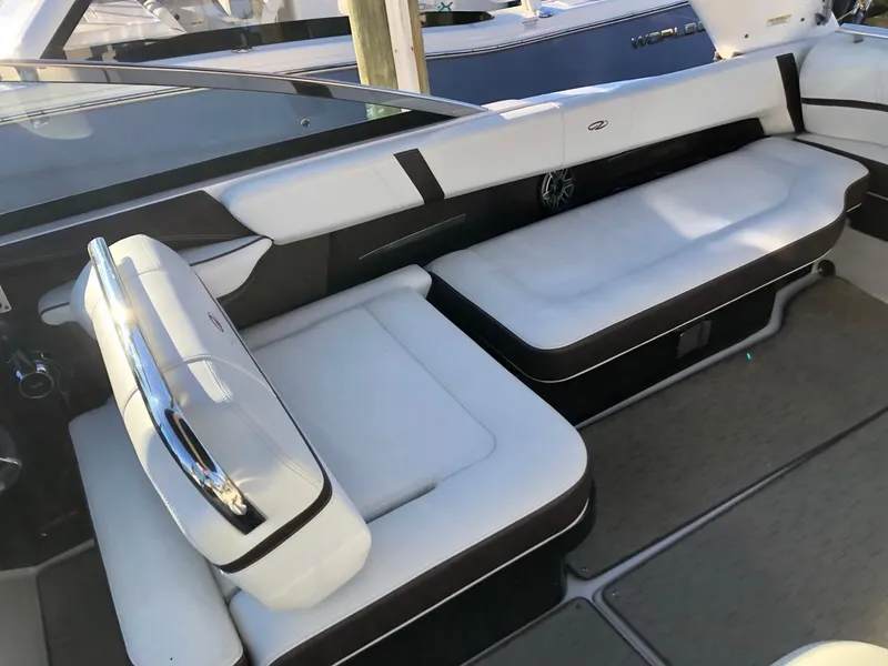 Slide: The Image of 2017 Regal 2800 boat interior with white seating and sleek design. - 30