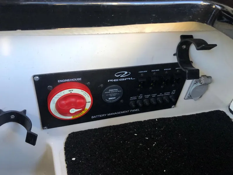 Slide: The Image of Battery management panel of 2017 Regal 2800 boat, featuring engine controls and switches. - 38