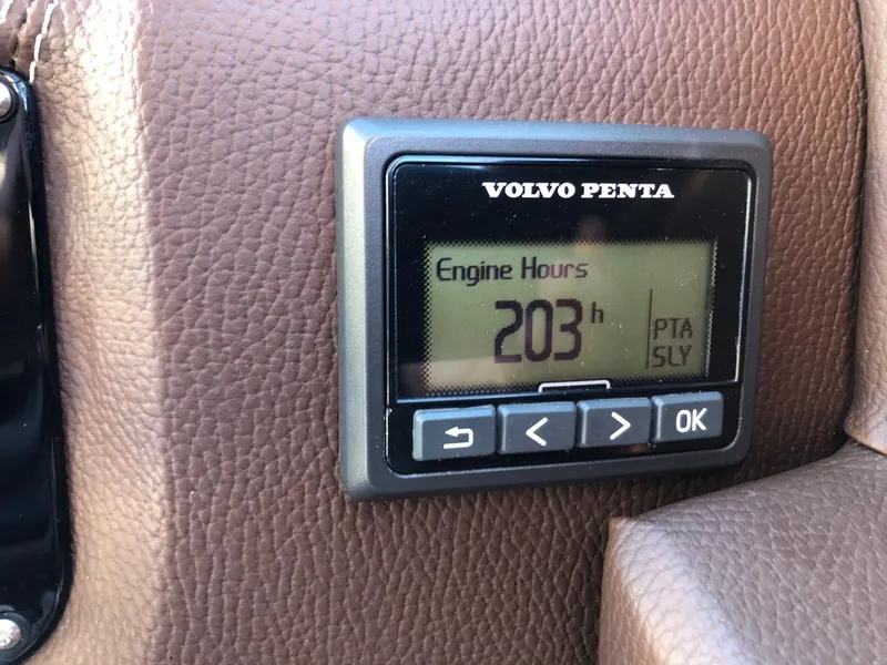 Slide: The Image of 2017 Regal 2800 boat with spacious seating and teak deck, docked at marina. - 42