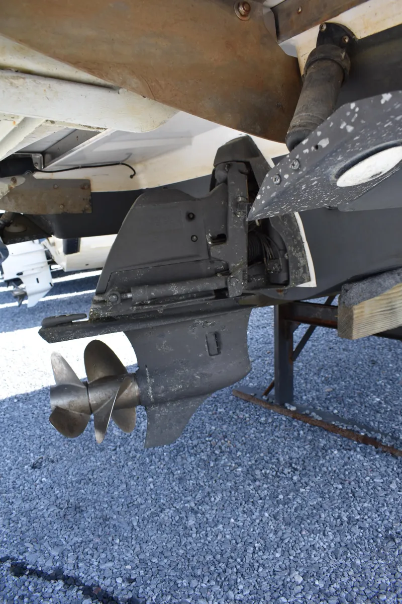 Slide: The Image of Close-up of 2017 Regal 2800 boat propeller on gravel surface. - 48