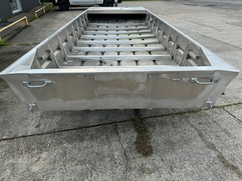 Slide: The Image of 2024 Go-Devil 16 x 60 Crawfish boat on concrete surface, rear view. - 5