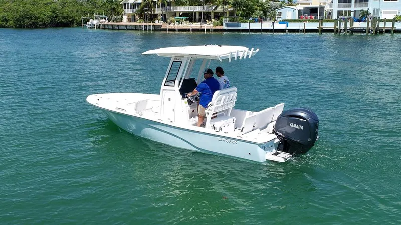 Slide: The Image of 2025 Sea Fox 231 Bay Fox boat cruising on clear blue water. - 5