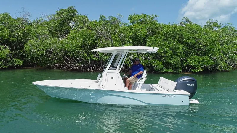 Slide: The Image of 2025 Sea Fox 231 Bay Fox boat cruising on a serene waterway. - 6