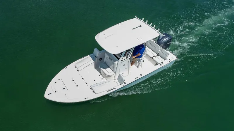 Slide: The Image of 2025 Sea Fox 231 Bay Fox boat cruising on green water. - 7
