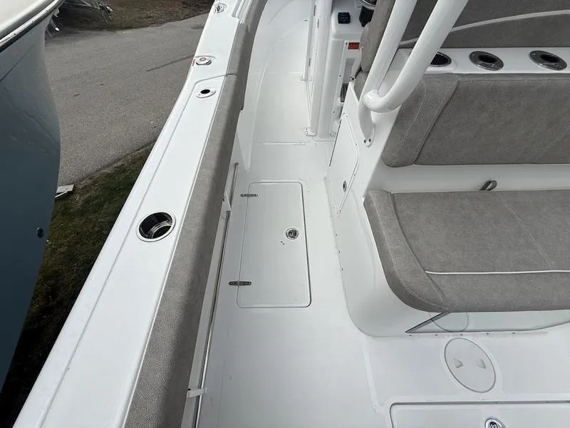 Slide: The Image of 2025 Sea Hunt Gamefish 28 Coffin Box boat interior with seating and storage compartments. - 12