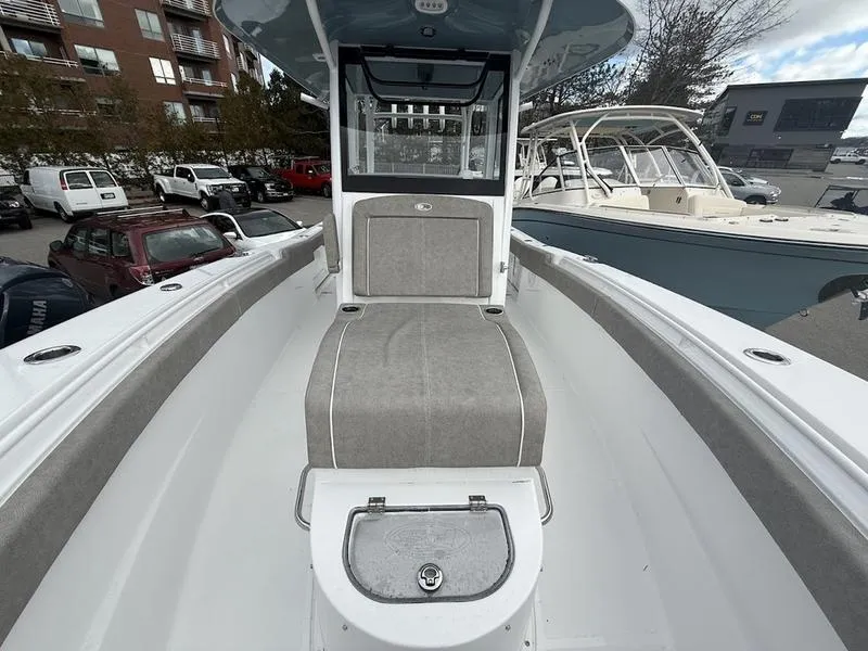 Slide: The Image of 2025 Sea Hunt Gamefish 28 Coffin Box boat interior, featuring spacious seating and storage. - 16