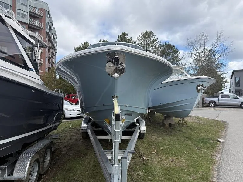 Slide: The Image of 2025 Sea Hunt Gamefish 28 Coffin Box boat on trailer, parked outdoors. - 3
