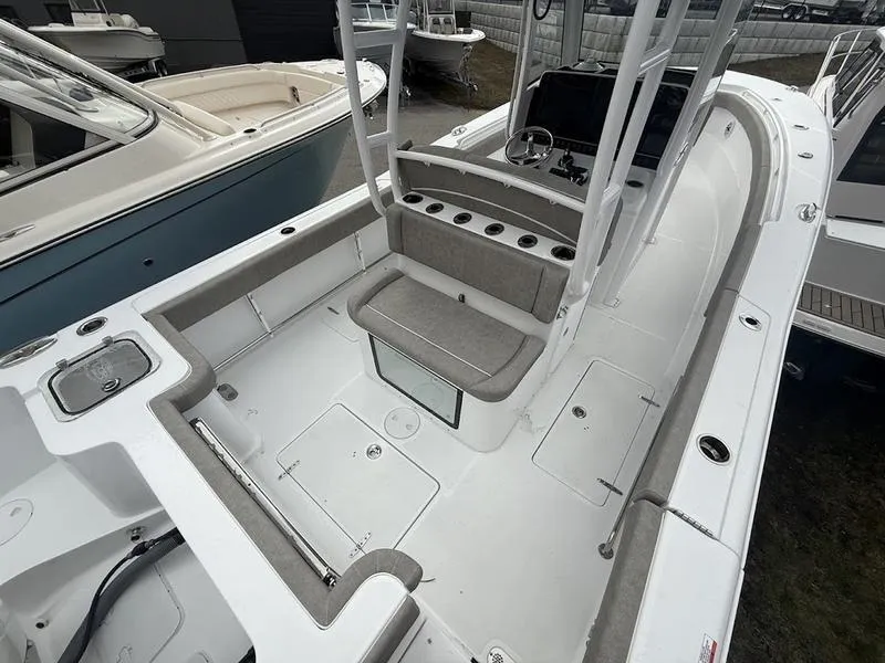 Slide: The Image of 2025 Sea Hunt Gamefish 28 Coffin Box boat interior with seating and storage compartments. - 7