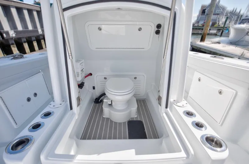 Slide: The Image of 2025 Yellowfin 32 Offshore boat interior with modern marine toilet. - 19