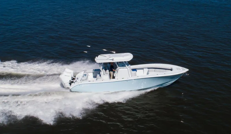 Slide: The Image of 2025 Yellowfin 32 Offshore boat cruising on open water. - 3