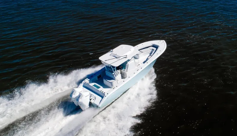 Slide: The Image of 2025 Yellowfin 32 Offshore boat cruising on open water. - 4