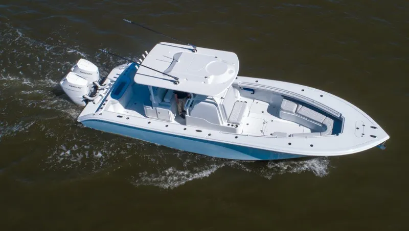 Slide: The Image of 2025 Yellowfin 32 Offshore boat cruising on open water. - 6