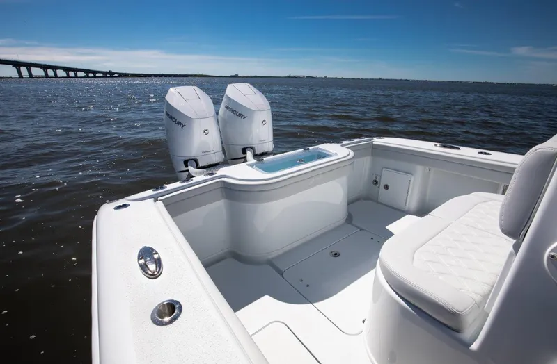 Slide: The Image of 2025 Yellowfin 32 Offshore boat with twin Mercury engines on open water. - 9