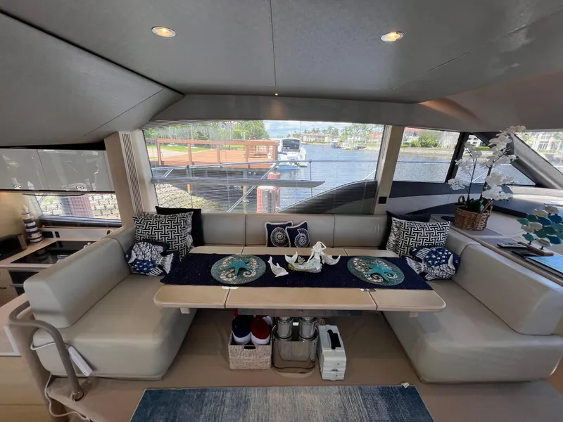 Slide: The Image of Luxurious 2018 Princess F55 yacht interior with elegant dining area and scenic water views. - 12