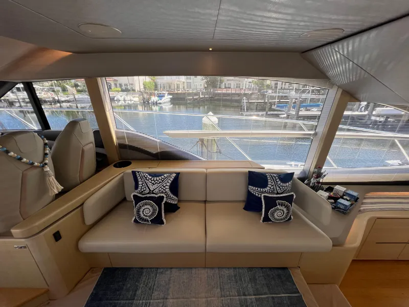 Slide: The Image of Luxurious 2018 Princess F55 yacht interior with elegant seating and nautical-themed cushions. - 13