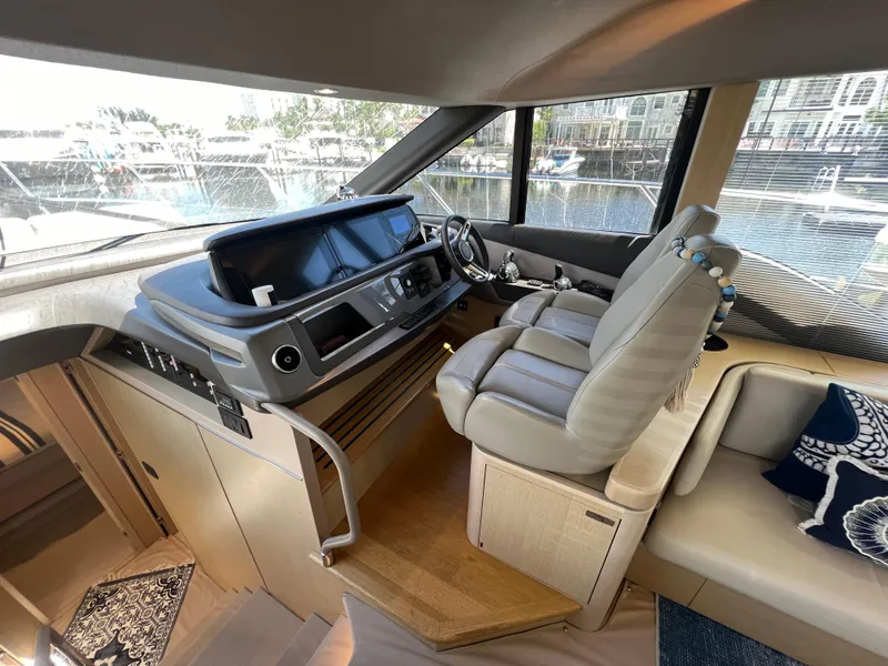 Slide: The Image of Luxurious 2018 Princess F55 yacht interior with modern helm and comfortable seating. - 15