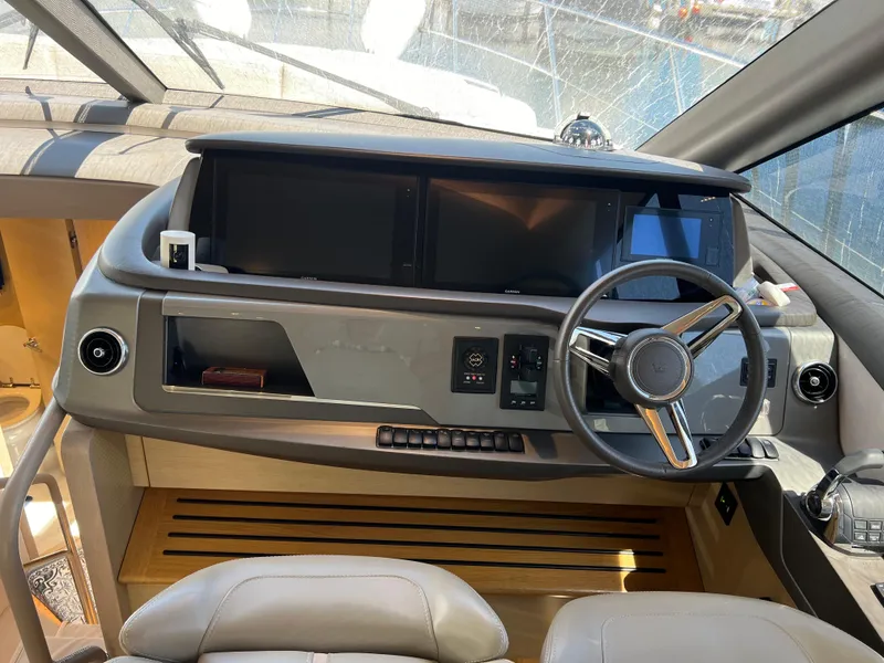 Slide: The Image of Luxury yacht helm of 2018 Princess F55 with modern controls and steering wheel. - 16