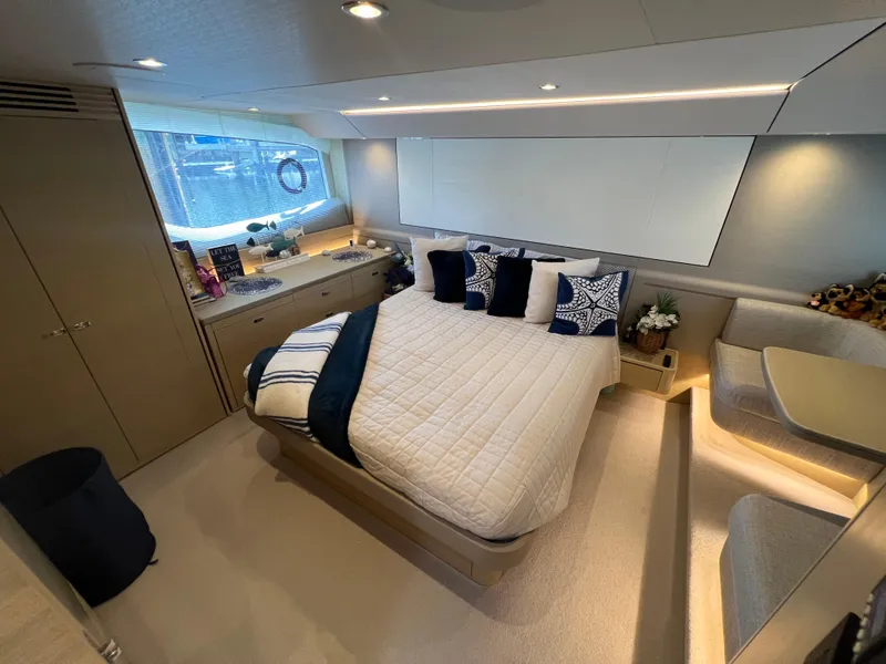 Slide: The Image of Luxurious 2018 Princess F55 yacht bedroom with modern decor and elegant furnishings. - 19