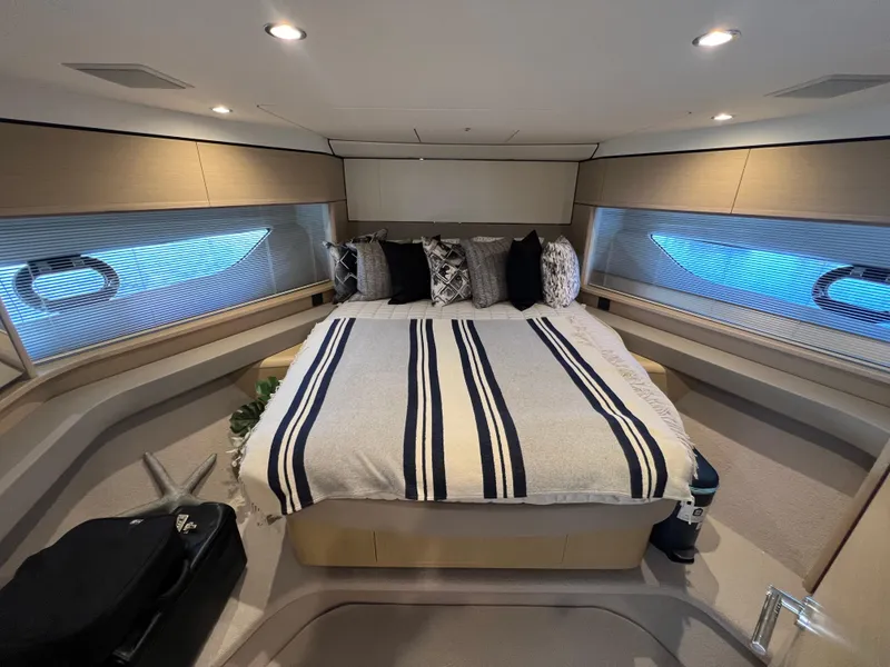 Slide: The Image of Luxurious bedroom interior of 2018 Princess F55 yacht with modern decor and ambient lighting. - 21