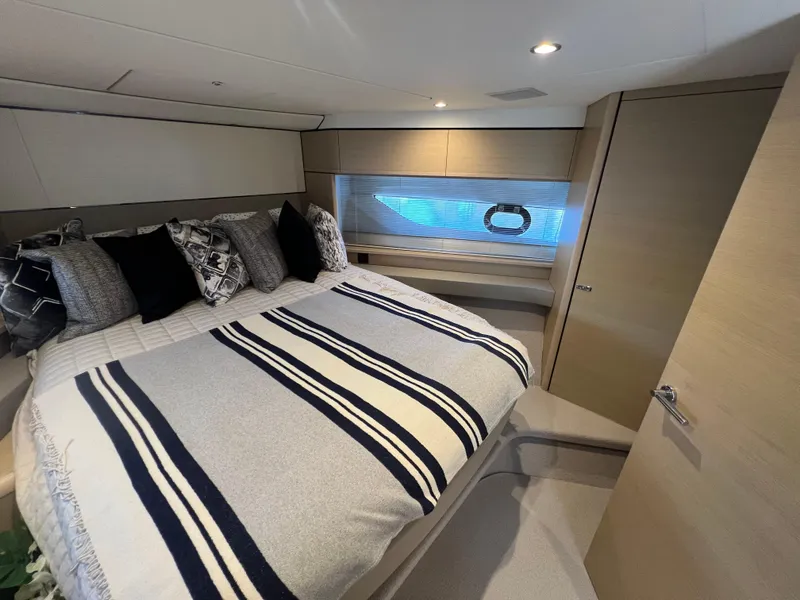 Slide: The Image of Luxurious bedroom interior of 2018 Princess F55 yacht with striped bedding. - 22