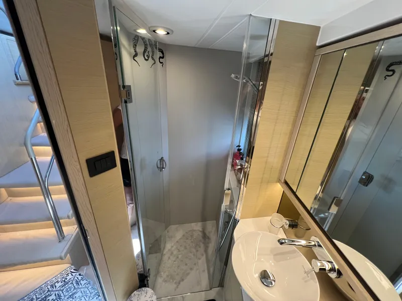 Slide: The Image of Luxurious bathroom in 2018 Princess F55 yacht with modern fixtures and glass shower. - 26