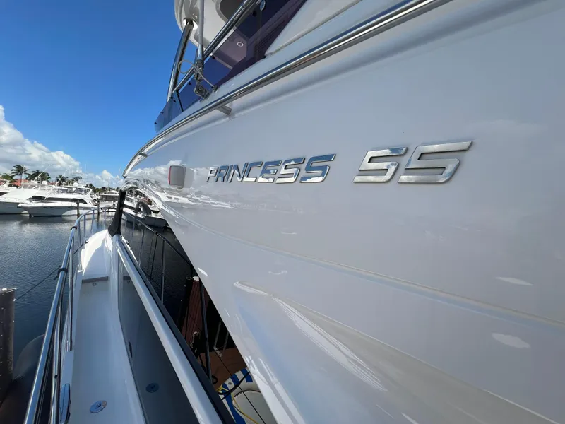 Slide: The Image of 2018 Princess F55 yacht docked at marina under clear blue sky. - 34