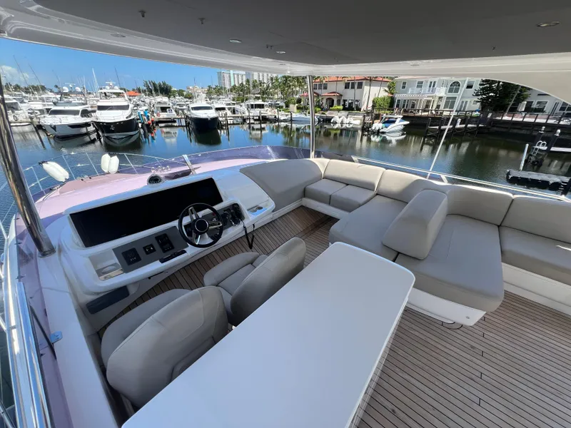 Slide: The Image of Luxurious 2018 Princess F55 yacht interior with spacious seating and marina view. - 37