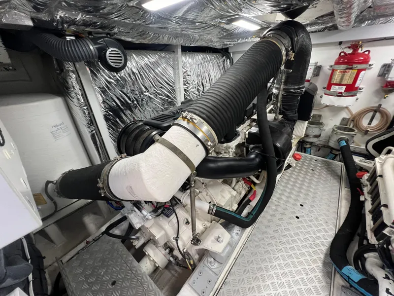 Slide: The Image of Engine room of 2018 Princess F55 yacht with visible exhaust system and fire extinguisher. - 44
