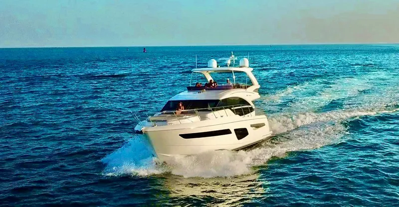 Slide: The Image of 2018 Princess F55 yacht cruising on open blue sea. - 6