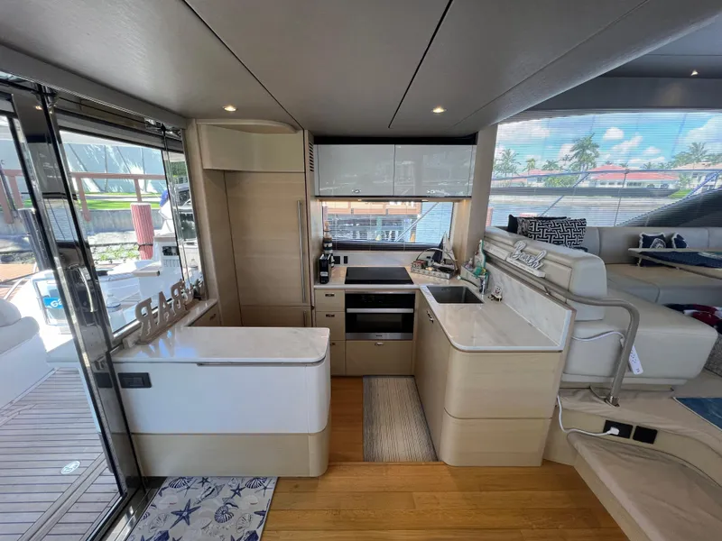 Slide: The Image of Luxurious interior of 2018 Princess F55 yacht with modern kitchen and seating area. - 9