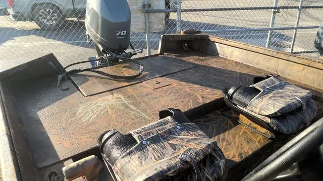 Slide: The Image of 2024 G3 17 SC boat with camo seats and 70 HP motor. - 4