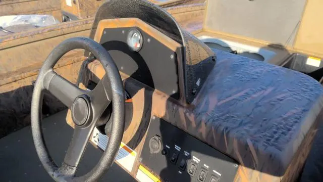 Slide: The Image of 2024 G3 17 SC boat dashboard with steering wheel and control panel. - 5