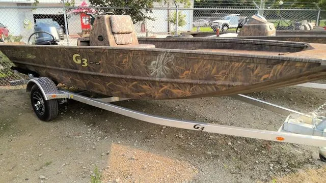 Slide: The Image of 2025 G3 17 CC boat with camouflage design on a trailer. - 1