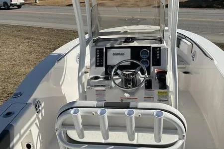 Slide: The Image of 2025 Robalo 200 CC boat interior with steering wheel and control panel. - 10