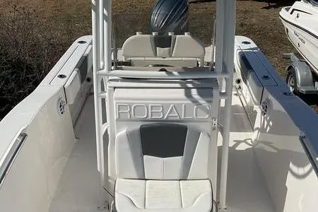 Slide: The Image of 2025 Robalo 200 CC boat interior with seating and console. - 11
