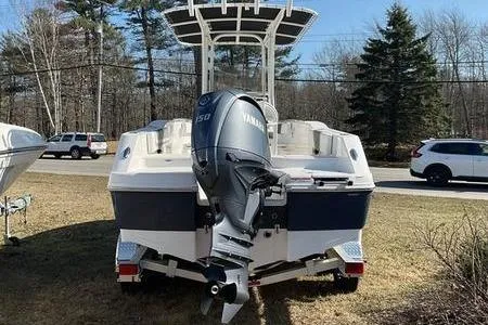 Slide: The Image of 2025 Robalo 200 CC boat with Yamaha outboard motor, parked on grass. - 4