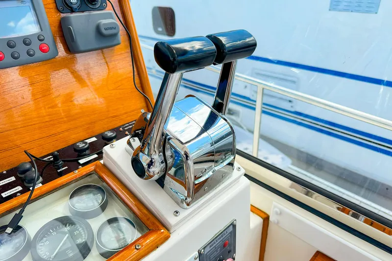 Slide: The Image of Control panel of a 1995 Grand Banks 38 Eastbay EX yacht with throttle levers. - 15