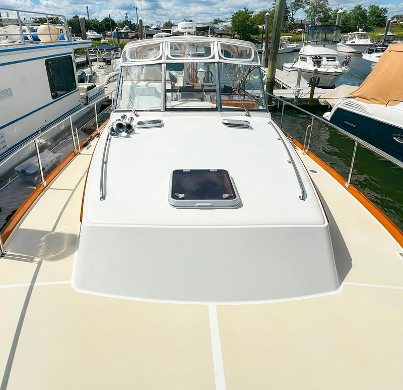 Slide: The Image of 1995 Grand Banks 38 Eastbay EX yacht docked at marina, sunny day. - 20