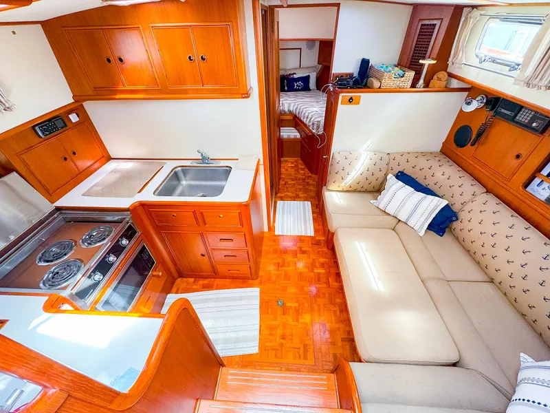 Slide: The Image of Interior of 1995 Grand Banks 38 Eastbay EX yacht with kitchen and seating area. - 22