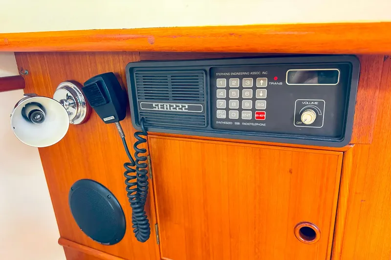 Slide: The Image of 1995 Grand Banks 38 Eastbay EX radio and speaker system on wooden panel. - 27